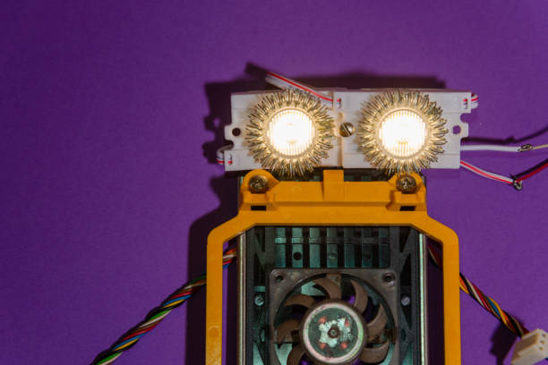 istock Hand made robot flat lay on the Open-sourced platform. DIY. AI. STEAM.purple background.Stem education for children and teenagers, robotics and electronics. 1479336882