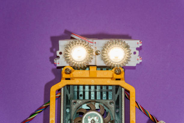 istock Hand made robot flat lay on the Open-sourced platform. DIY. AI. STEAM.purple background.Stem education for children and teenagers, robotics and electronics. 1479336887