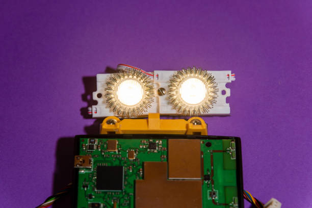 istock Hand made robot flat lay on the Open-sourced platform. DIY. AI. STEAM.purple background.Stem education for children and teenagers, robotics and electronics. 1479336894