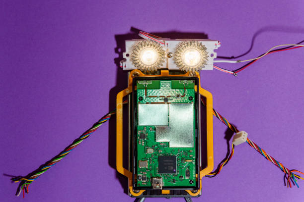 istock Hand made robot flat lay on the Open-sourced platform. DIY. AI. STEAM.purple background.Stem education for children and teenagers, robotics and electronics. 1479336895