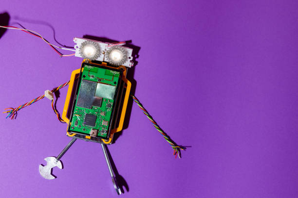 istock Hand made robot flat lay on the Open-sourced platform. DIY. AI. STEAM.purple background.Stem education for children and teenagers, robotics and electronics.Copy space. 1479336897