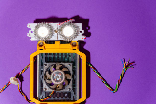 Hand made robot flat lay on the Open-sourced platform. DIY. AI. STEAM.purple background.Stem education for children and teenagers, robotics and electronics.