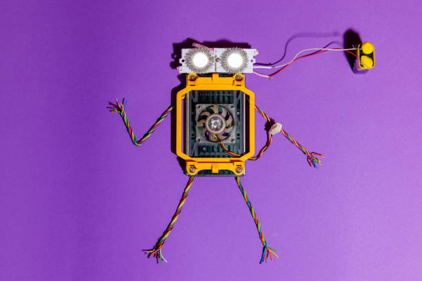 istock Hand made robot flat lay on the Open-sourced platform. DIY. AI. STEAM.purple background.Stem education for children and teenagers, robotics and electronics. 1479336903