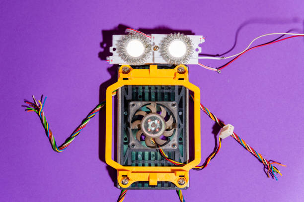 istock Hand made robot flat lay on the Open-sourced platform. DIY. AI. STEAM.purple background.Stem education for children and teenagers, robotics and electronics. 1479336906