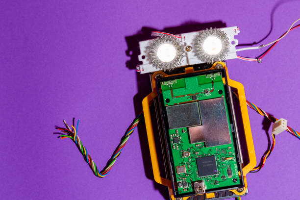istock Hand made robot flat lay on the Open-sourced platform. DIY. AI. STEAM.purple background.Stem education for children and teenagers, robotics and electronics. 1479336916