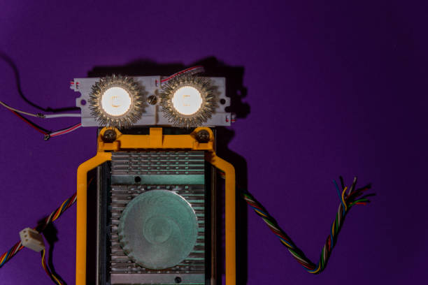 istock Hand made robot flat lay on the Open-sourced platform. DIY. AI. STEAM.purple background.Stem education for children and teenagers, robotics and electronics. 1479336938