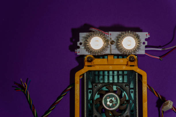 Hand made robot flat lay on the Open-sourced platform. DIY. AI. STEAM.Dark purple background.Stem education for children and teenagers, robotics and electronics.