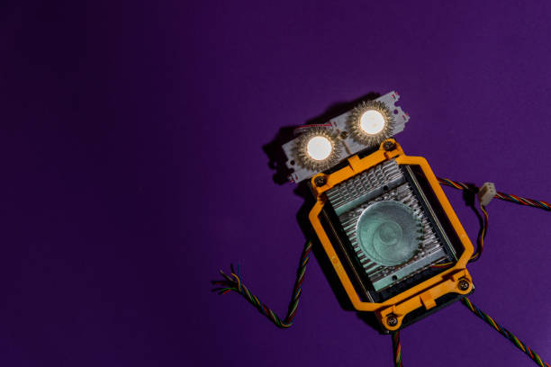 istock Hand made robot flat lay on the Open-sourced platform. DIY. AI. STEAM.purple dark background.Stem education for children and teenagers, robotics and electronics.Copy space. 1479336966