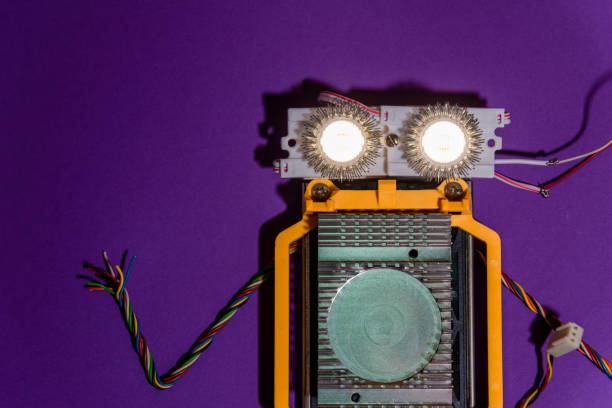 istock Hand made robot flat lay on the Open-sourced platform. DIY. AI. STEAM.purple background.Stem education for children and teenagers, robotics and electronics. 1479336971