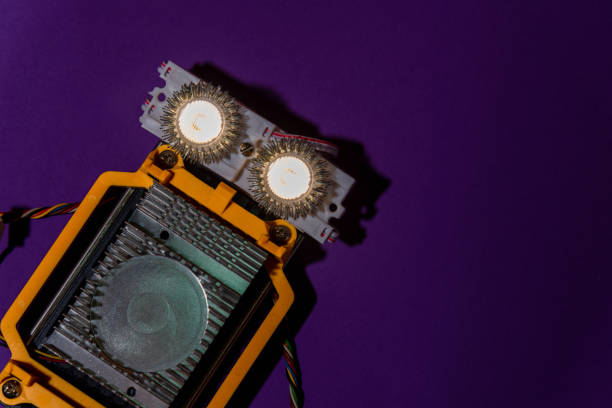 istock Hand made robot flat lay on the Open-sourced platform. DIY. AI. STEAM.purple dark background.Stem education for children and teenagers, robotics and electronics.Copy space. 1479336977