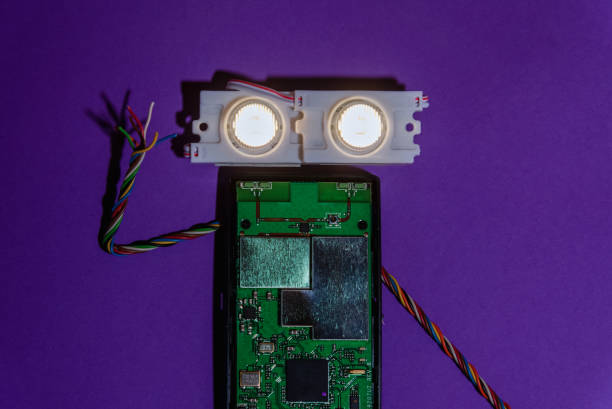 Hand made robot flat lay on the Open-sourced platform. DIY. AI. STEAM.purple background.Stem education for children and teenagers, robotics and electronics.