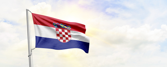 Croatia flag waving on sky background. 3D Rendering