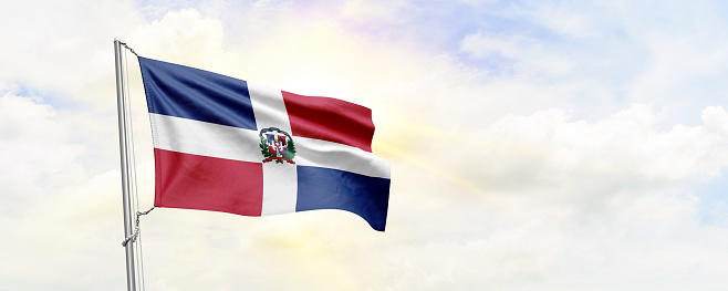 Dominican Republic flag waving on sky background. 3D Rendering