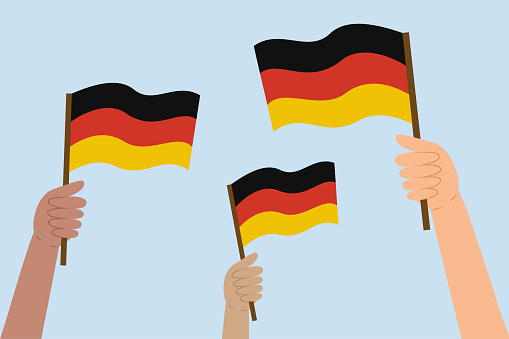 Diverse people's hands holding German flags. Flag of the Germany. Vector illustration in flat style on blue background.