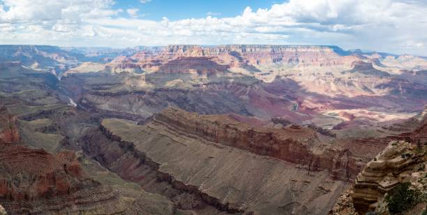 istock the grand canyon is surrounded by mountains and clouds in this view 1479340406