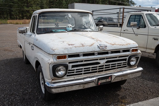 Fredonia, United States – September 07, 2022: A Ford F-100 white truck parked in a parking lot