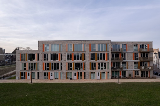 Exterior facade aerial of Ubuntuplein residential housing at the Ettegerpark during sunrise. Dutch engineering urban development
