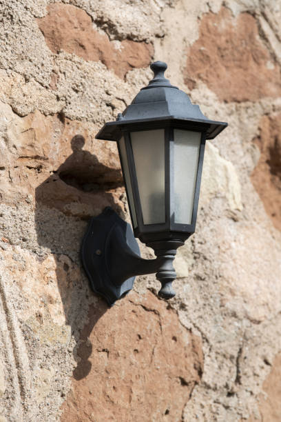 istock Vintage street light mounted on the weathered wall 1479341194