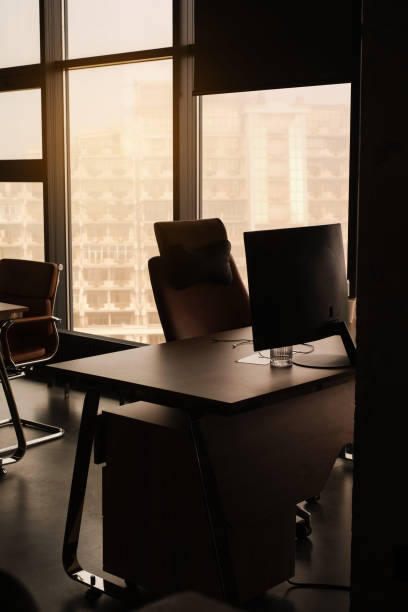 istock company director's office with empty desktop with panoramic windows at sunset 1479344944