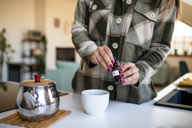 istock Woman added CBD oil into tea 1479345232