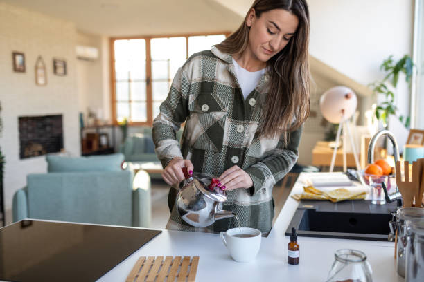 istock Woman having tea with CBD oil 1479345353