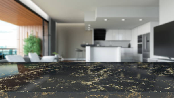 istock Black Marble Table Surface with a Blurred Living Room as a Background 1479345791