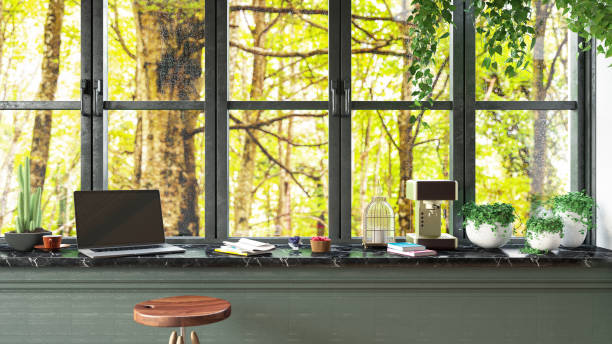 istock Loft Kitchen Counter with a Rainy Forest View Laptop and Breakfast 1479345948
