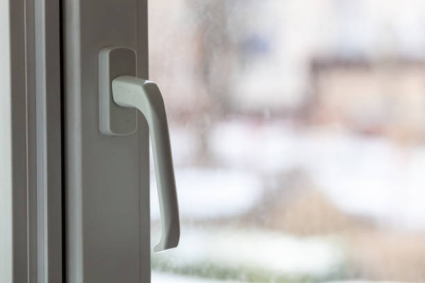 istock Closed white plastic pvc window in winter on a cloudy day. 1479345995