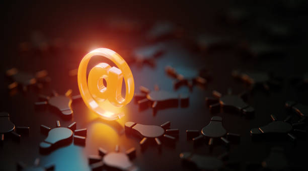 istock Orange At Symbol Glowing Amid Black Lightbulb Symbols On Black Background 1479348093
