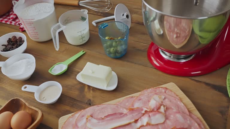 Slow motion view of panning view of ingredients for ham bread baking or 