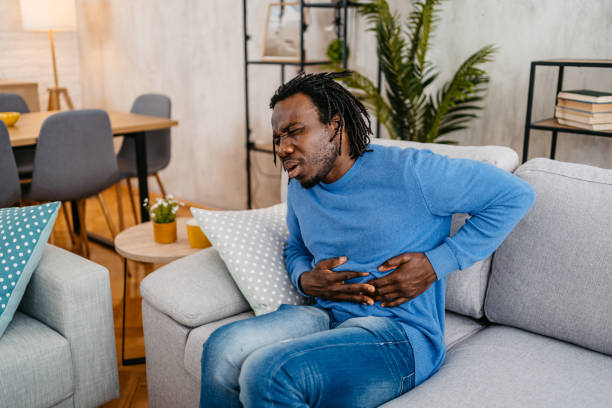 istock Young Man Having Stomach Pain At Home 1479350583