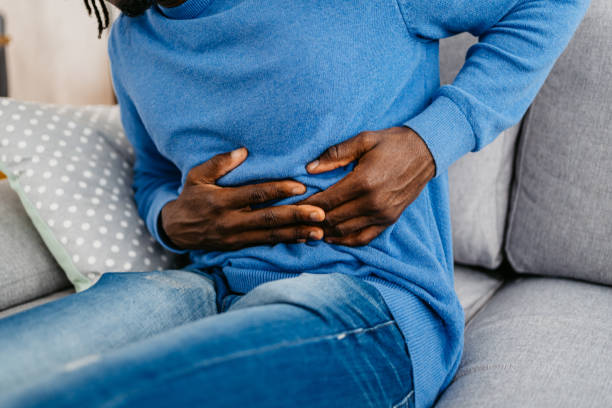 istock Young Man Having Stomach Pain At Home 1479350615