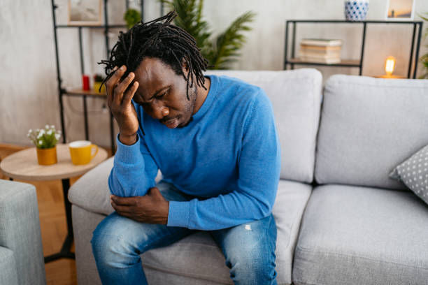 istock Young Man Having A Headache At Home 1479351131