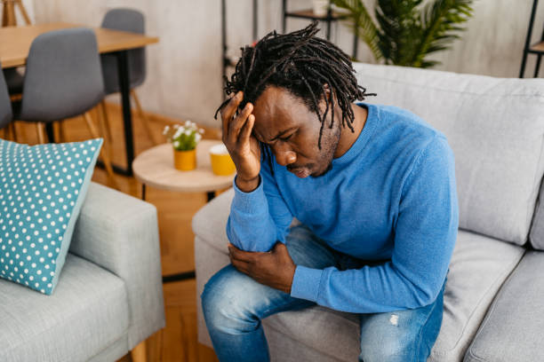 istock Young Man Having A Headache At Home 1479353276
