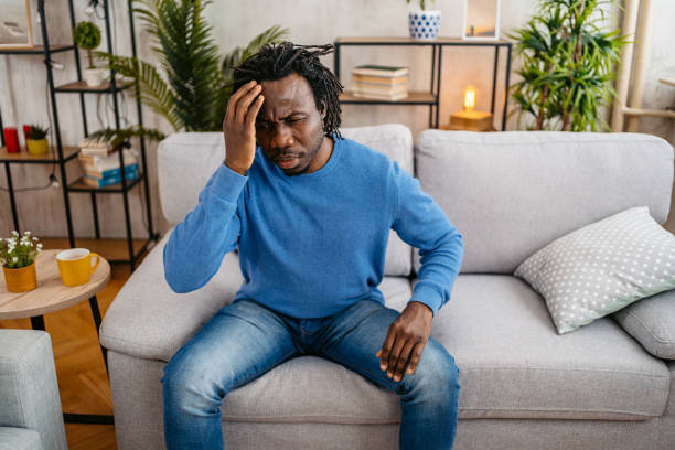istock Young Man Having A Headache At Home 1479353591