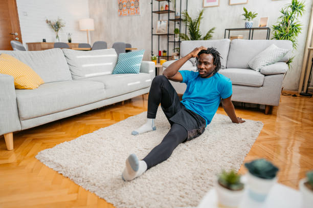 istock Young Man Taking A Break After Exercising At Home 1479353614