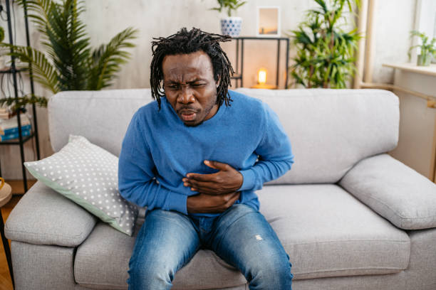 istock Young Man Having Stomach Pain At Home 1479355040