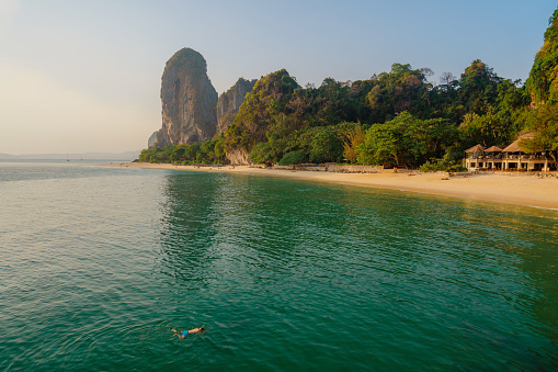 Scenic view of man swimming in the sea Railey beach