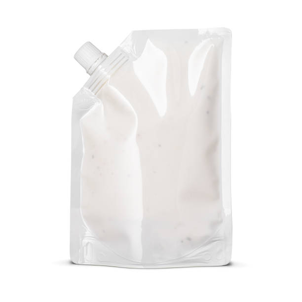 istock Mayo sauce in blank glossy white doypack bag with corner cap isolated on white . Front view of stand-up pouch. 1479358014
