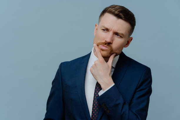 istock Frustrated businessman thinking about something and looking away 1479358289
