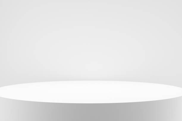 istock Modern empty round white circle podium, platform or pedestal against white wall. 1479360526