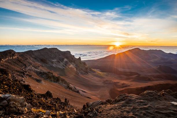 istock the sun is setting over some mountains with the sky above them 1479362267