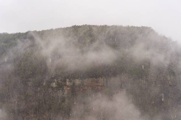 istock Majestic mountain stands shrouded in mist and low-hanging clouds 1479362886
