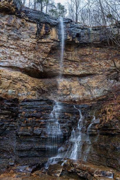 istock Majestic waterfall cascading down a sheer rock face into a tranquil pool of water below 1479362943