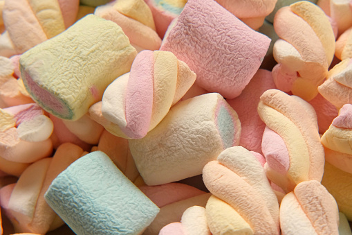 Colorful marshmallow spinning, rotation. Sweet food background. Close up. Video backdrop. Heap of multi-colored candies with different flavours. Group of tasty marshmallows. Confectionery. Sweet shop. Sugary yummy food. Sugar
