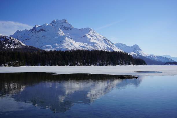 istock Tranquil winter landscape featuring a serene lake with a dusting of snow 1479363406