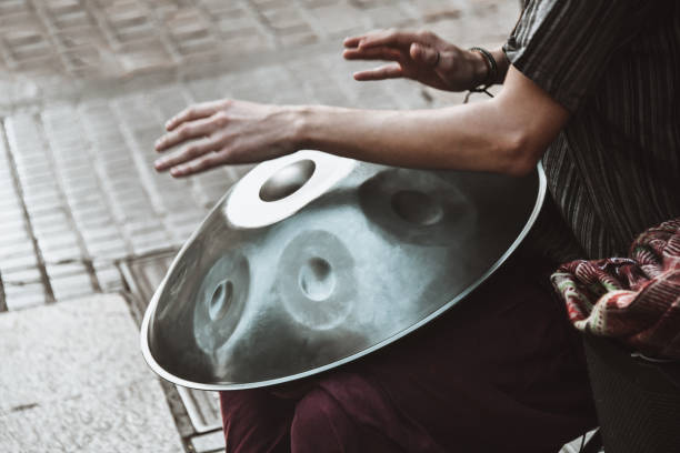 Street Musician Playing On Hand Pan In Santa Cruz De Tenerife, Spain Street Musician Playing On Hand Pan In Santa Cruz De Tenerife, Spain steel drum stock pictures, royalty-free photos & images