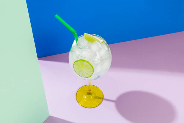 istock gin cocktail served with iced alcoholic beverage, colored background 1479366119