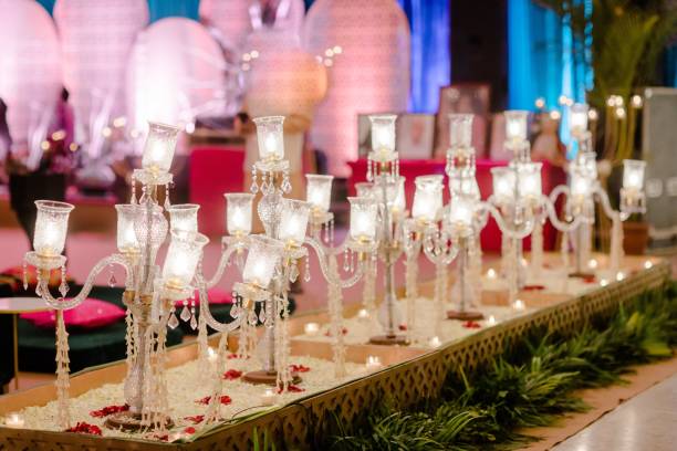 istock several different types of lit candles on a long table with other items 1479367454