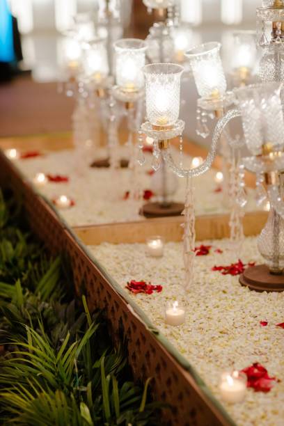istock Festive tablescape featuring numerous tall candles, adorned with red floral arrangements 1479367507